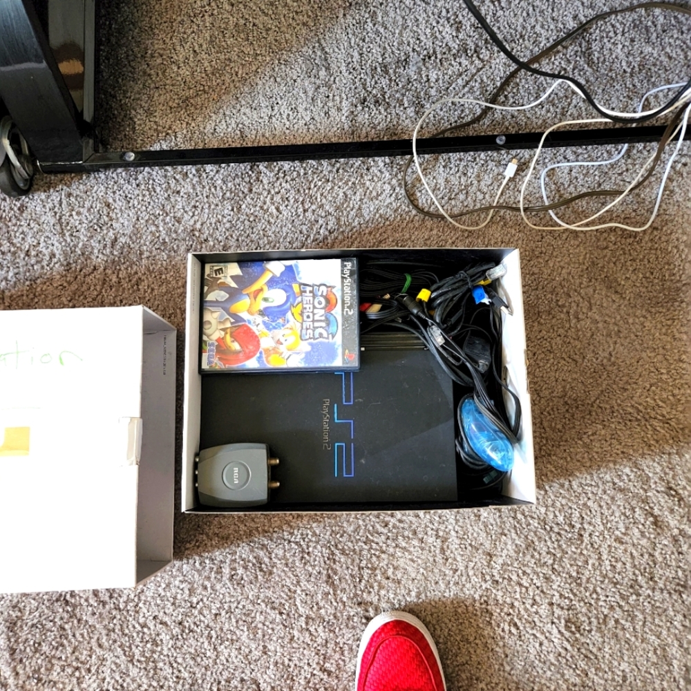 Play station 2 with cords and controller and one game